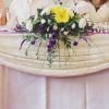 cadbury purple yellow wedding reception top table floral arrangement Hitchi